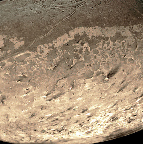 A picture of Neptune's moon, Triton, taken by Voyager 2 on its flyby