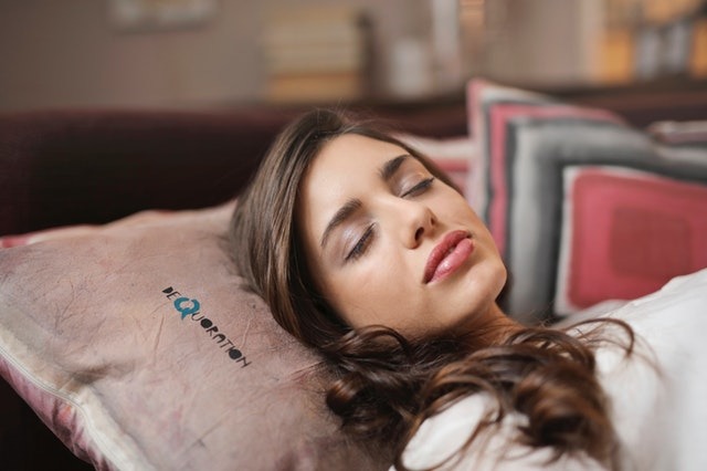 woman asleep on bed